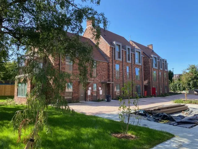 Completed brick townhouses with new landscaping on an EcoSkye residential scheme
